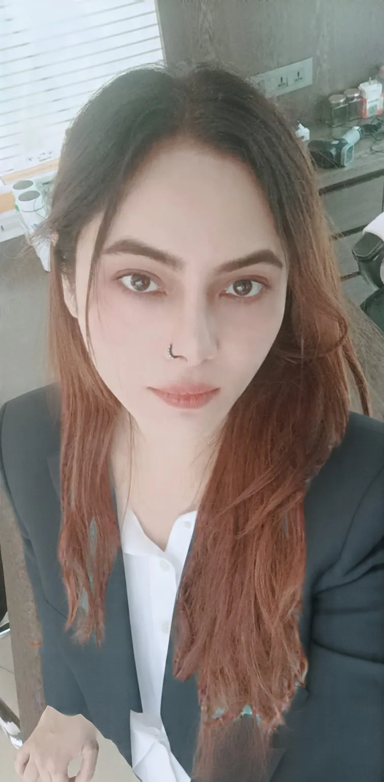 Portrait of Vibha Jain, hypnotherapist, wearing a dark blazer and looking directly at the camera.
