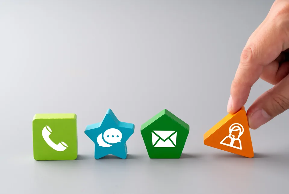 Colourful icon blocks representing a phone call, a message, an email and a support enquiry.